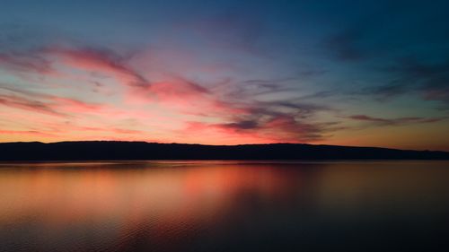 Free Dramatic sunset over Lake Baikal with reflections and colorful sky in Russia. Stock Photo