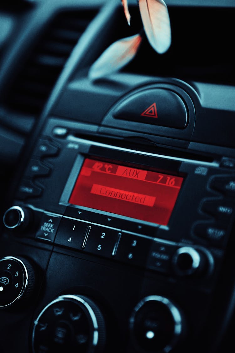 A Black Car Stereo Connected To The Aux