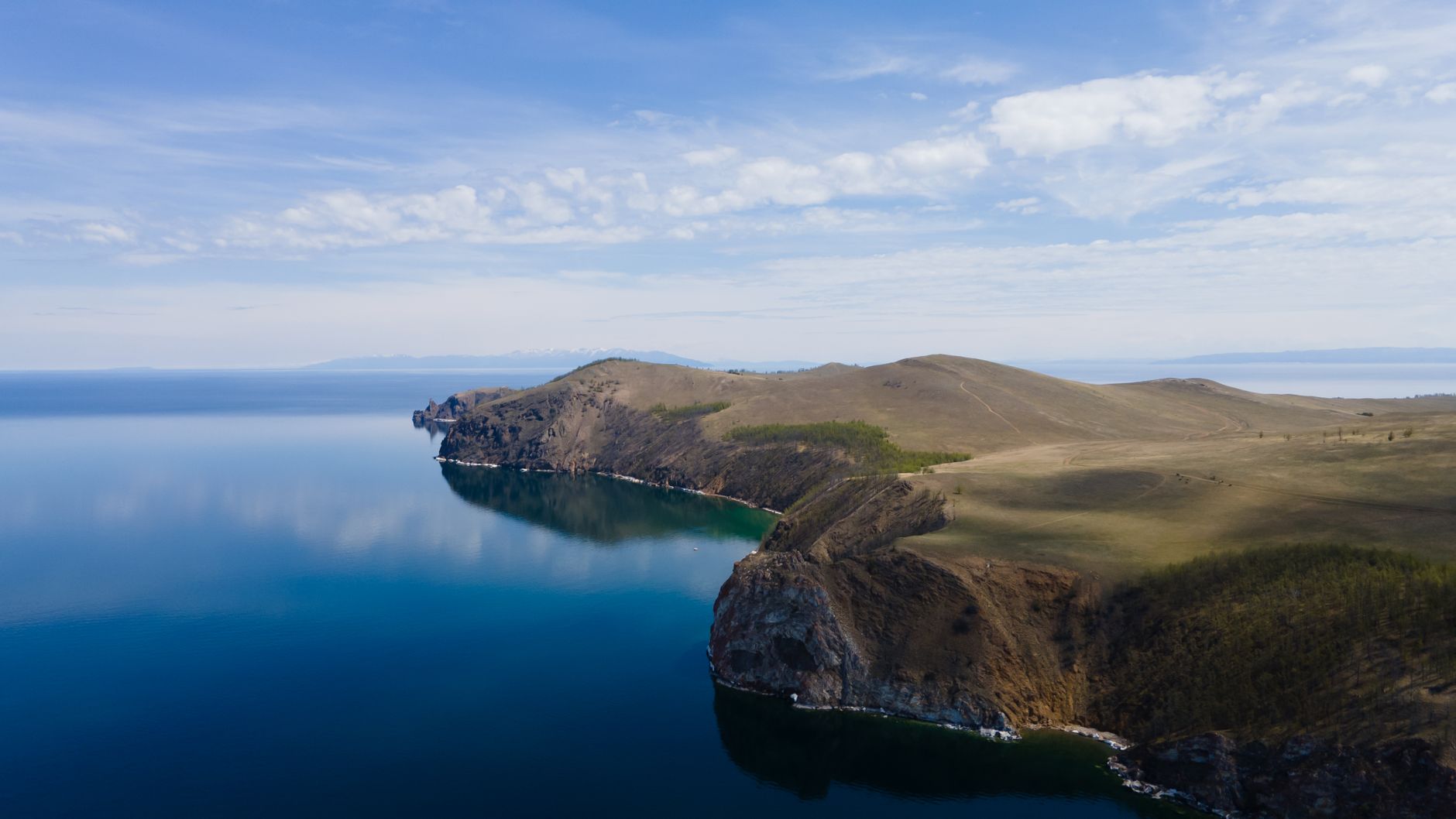 Stunning aerial view of Cape Khoboy at Lake Baikal, showcasing serene nature and clear blue waters.