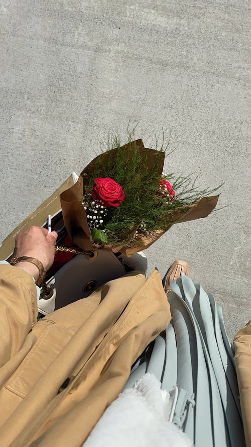 Hand Holding Bag with Flowers