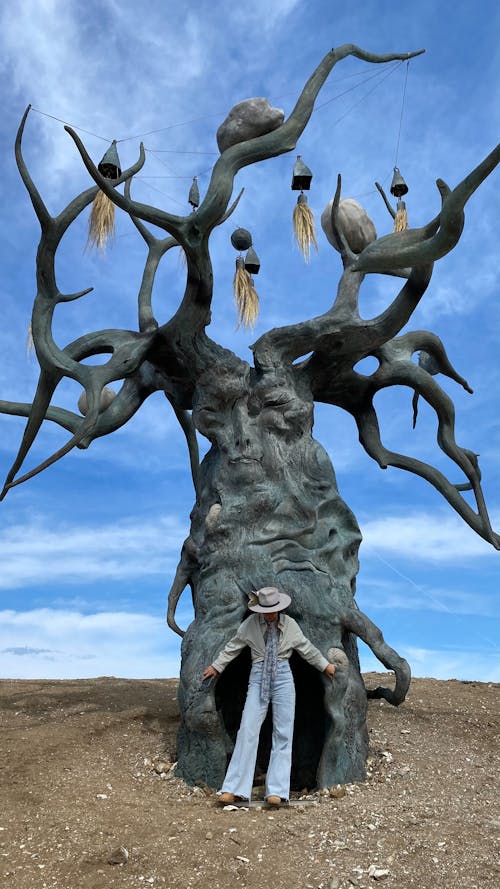 Man in front of Sculpture Khranitel Baykala, Russia