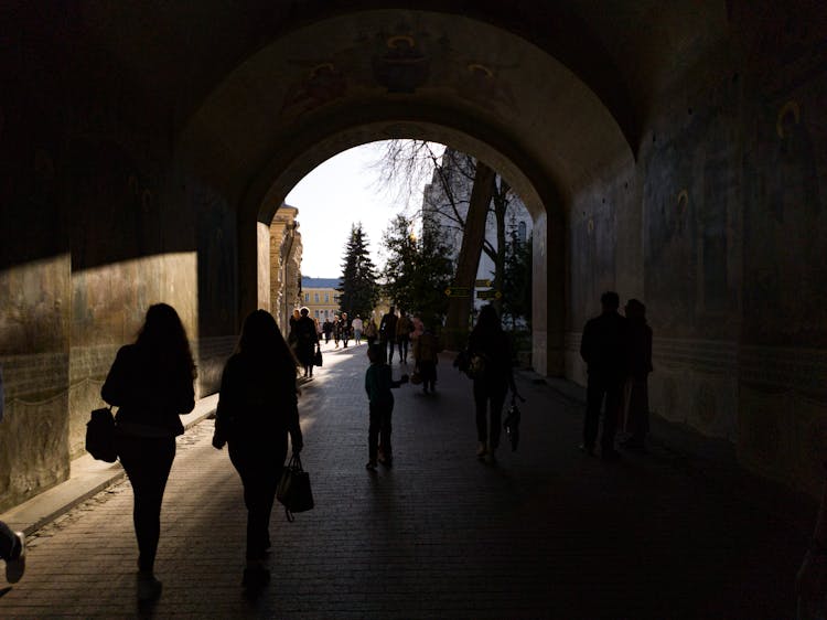 People Walking On Tunnel