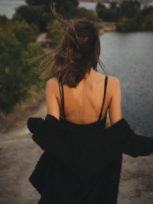 Back View of a Woman Wearing Black Clothes