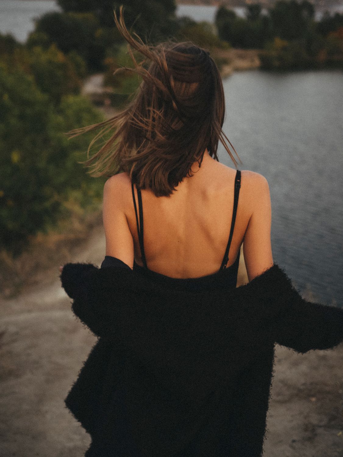 Back View of a Woman Wearing Black Clothes · Free Stock Photo