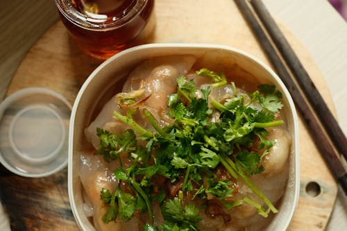 Free Dumplings with Parsley on Top in a Lunch Box Stock Photo