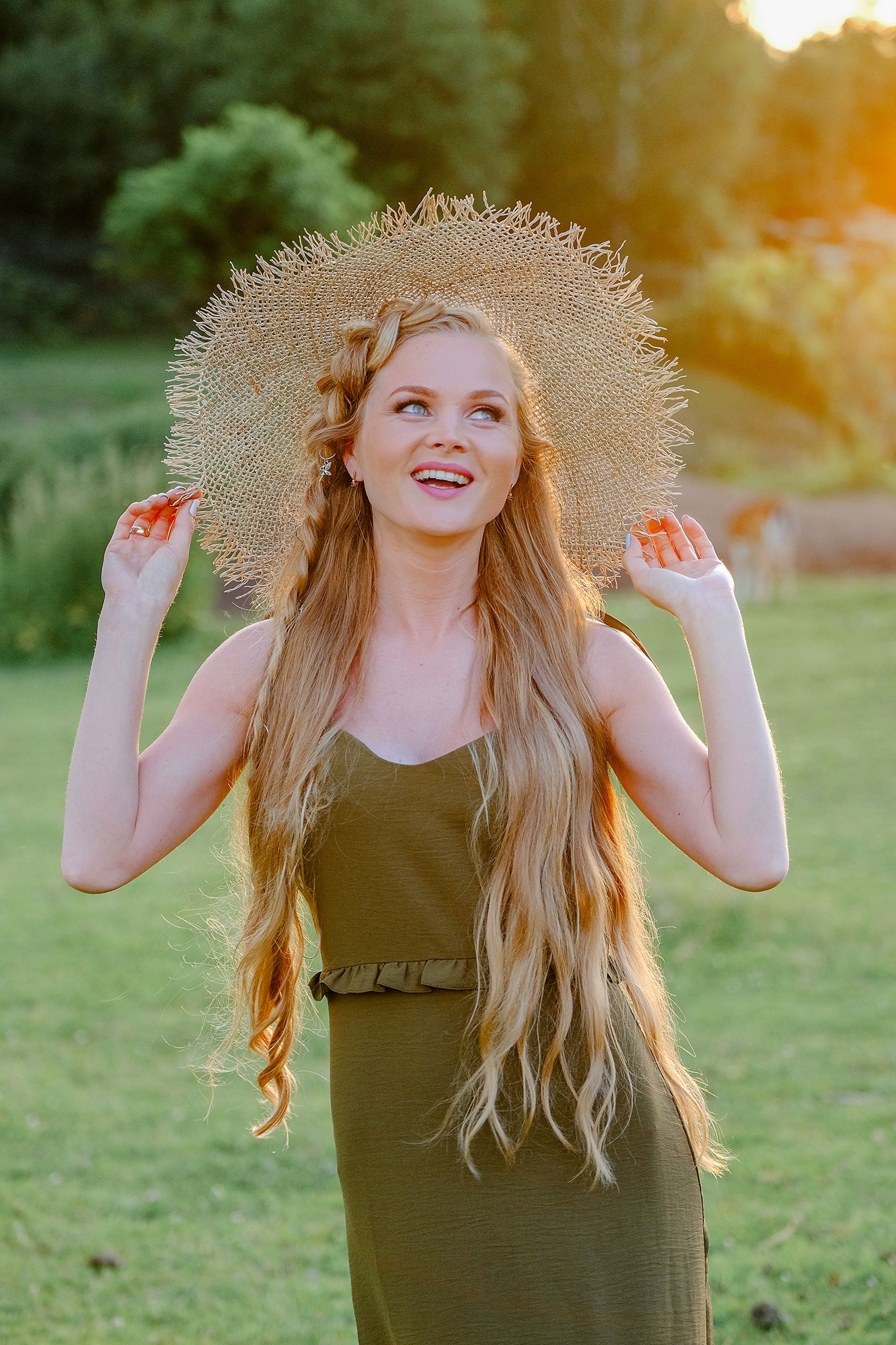 Photo of a Blonde Woman with Long Hair Touching Her Straw Hat · Free ...