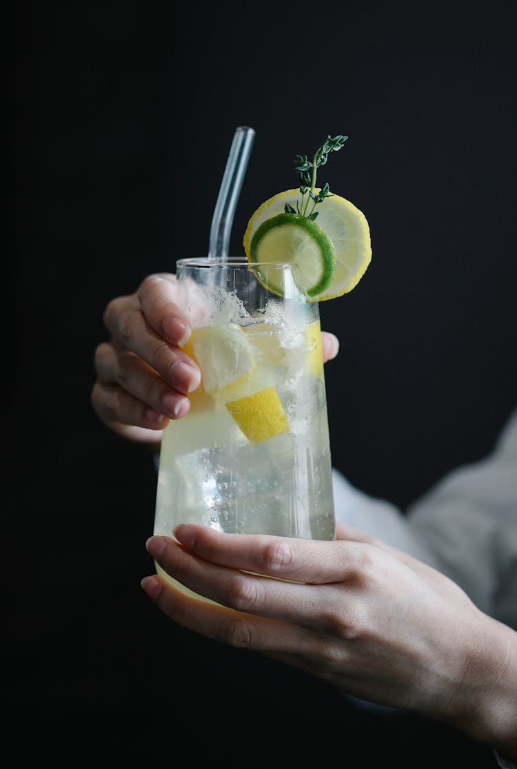 Person Holding Clear Drinking Glass With Lemonade