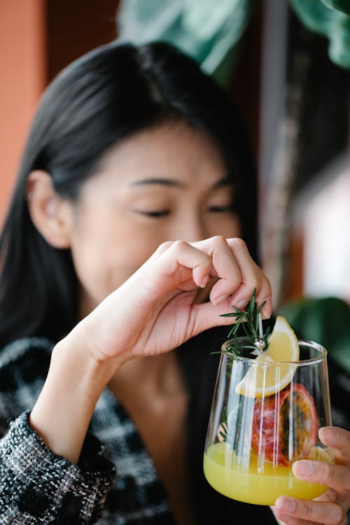 Woman Holding a Drink