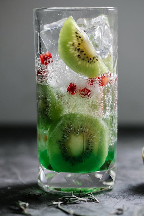 Green Fruit in Clear Drinking Glass