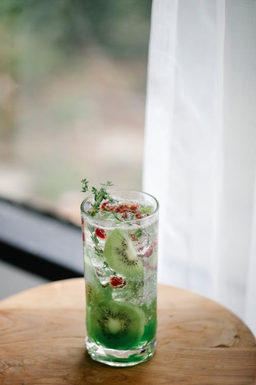 Green Fruit in Clear Drinking Glass