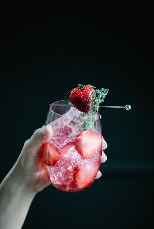 Drink on a Glass with Slices of Strawberries