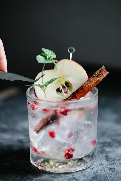 Free Beverage with Sliced Apple and Cinnamon Stick Stock Photo