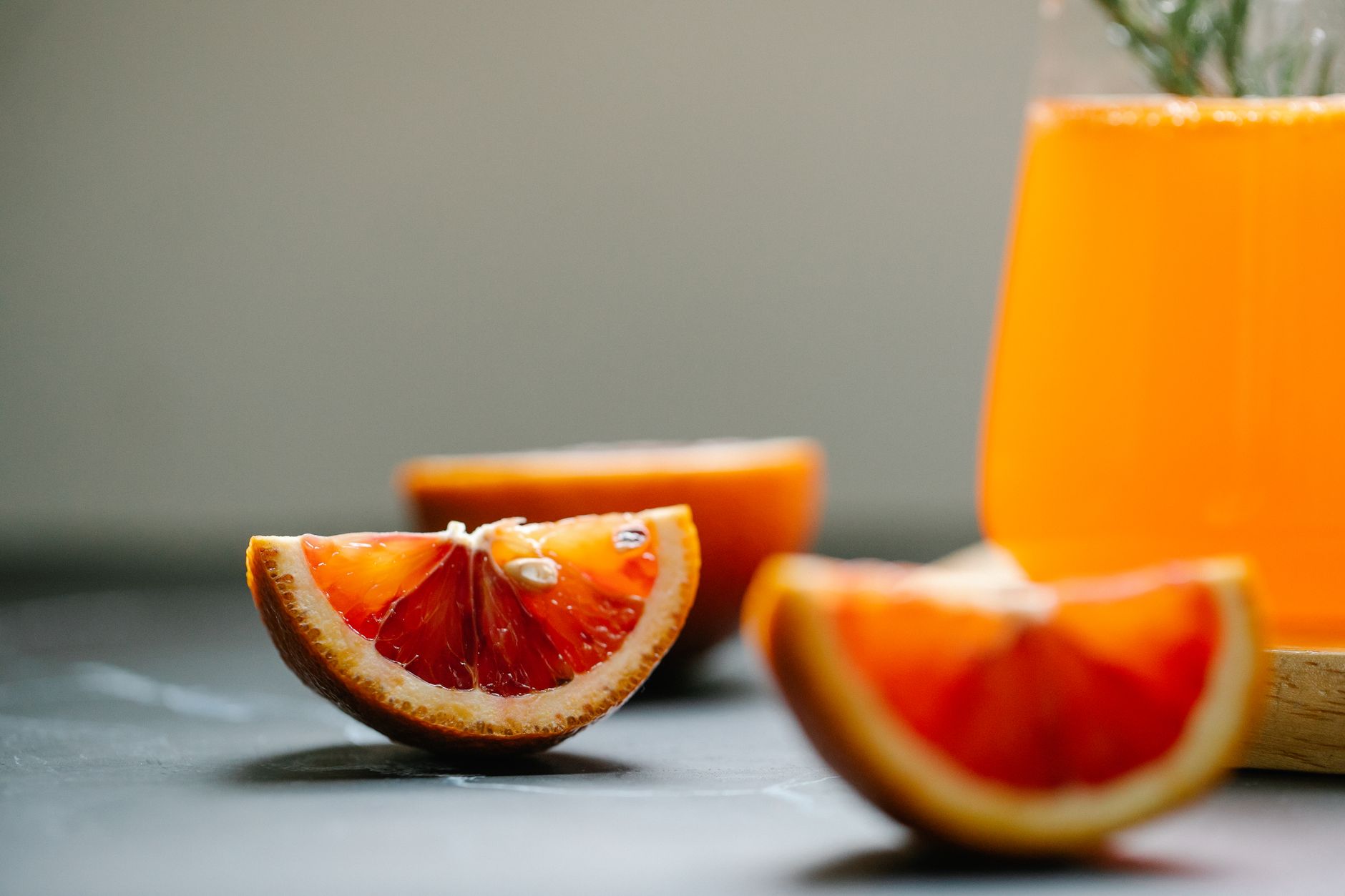 Close-up of a refreshing immune support drink with lemon and ginger on a wooden table