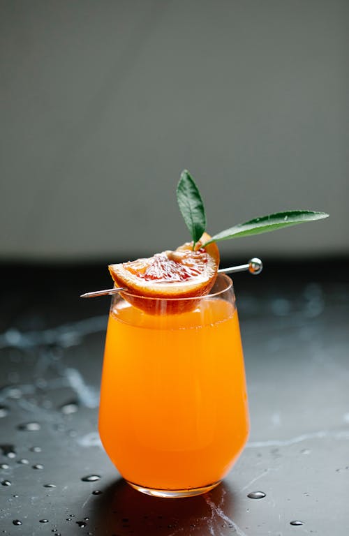 Orange Juice in Clear Drinking Glass