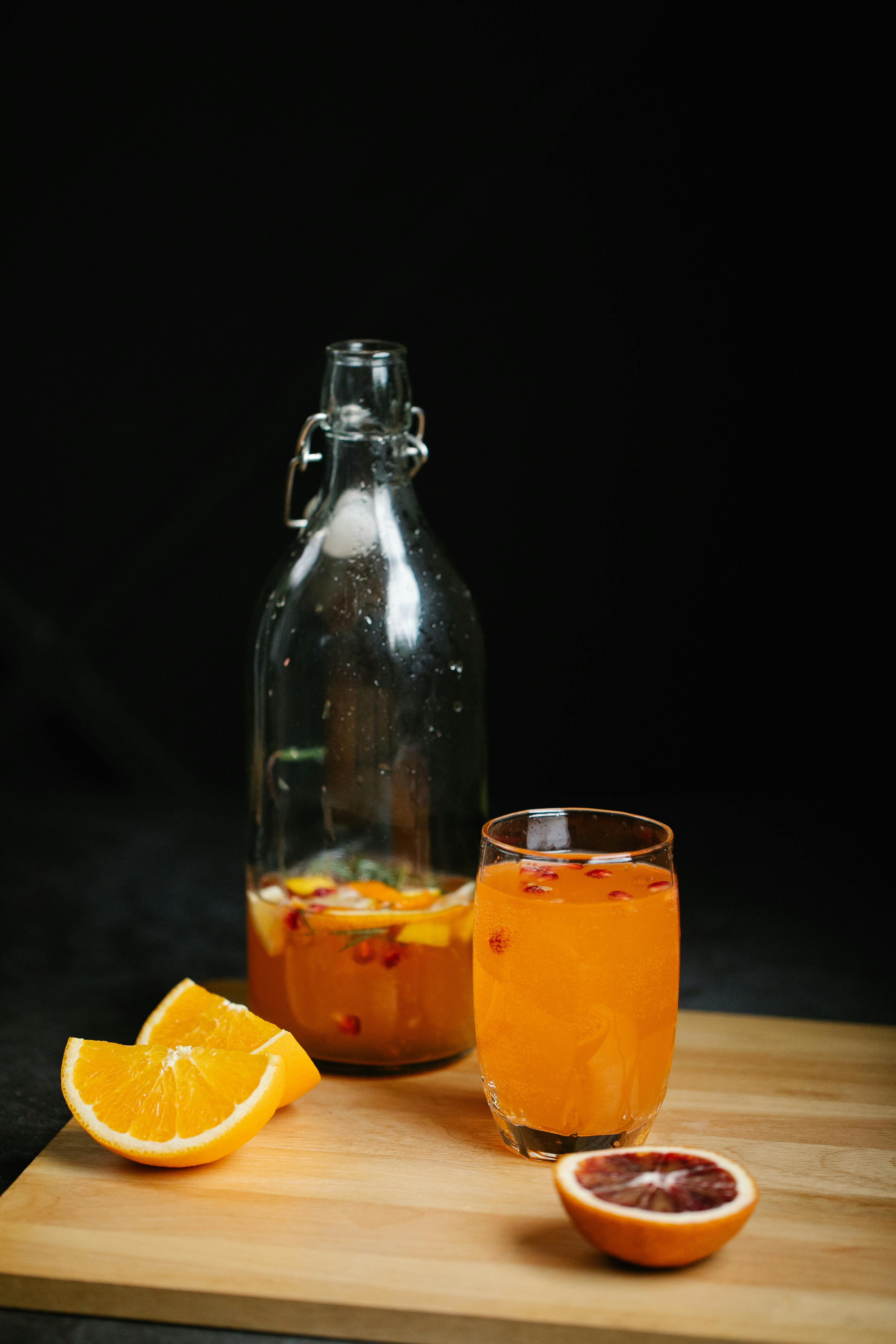 Juice In Glass Jar And Orange On Kitchen Table. Stock Photo, Picture and  Royalty Free Image. Image 14167034.