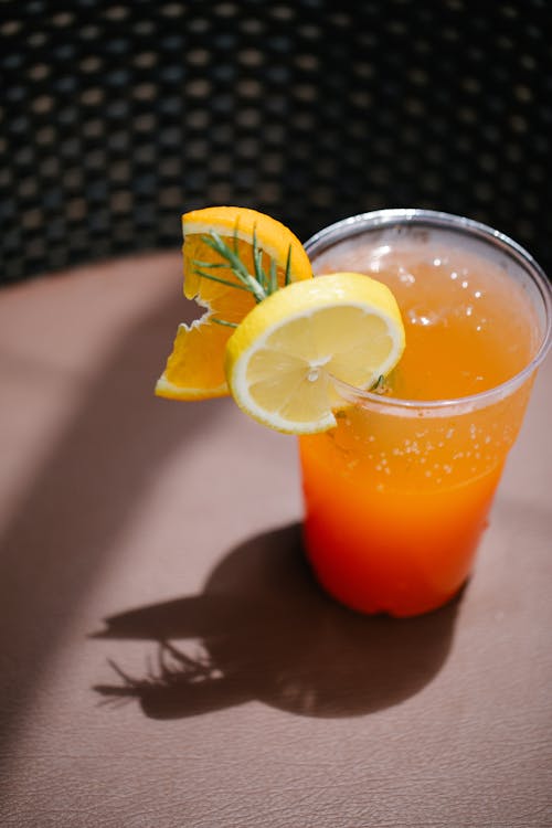 Plastic Drinking Glass with Orange Juice