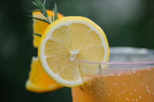 Close-Up Shot of a Sliced Lemon on Clear Glass