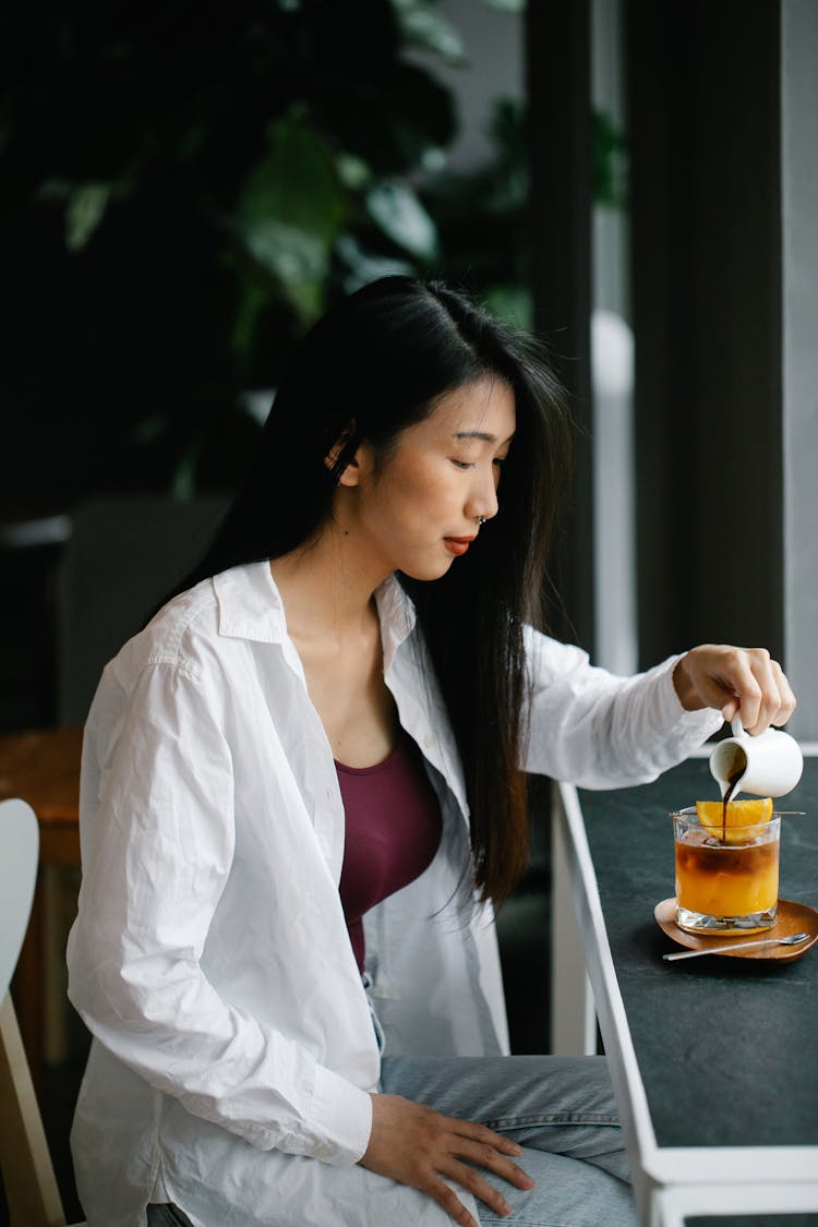 Woman Sitting With Tea Glass