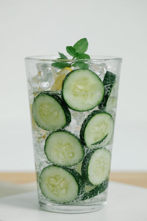 Water with Slices of Cucumber in Drinking Glass