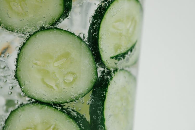 Close-up Of Cucumber Slices In A Glass With Water 