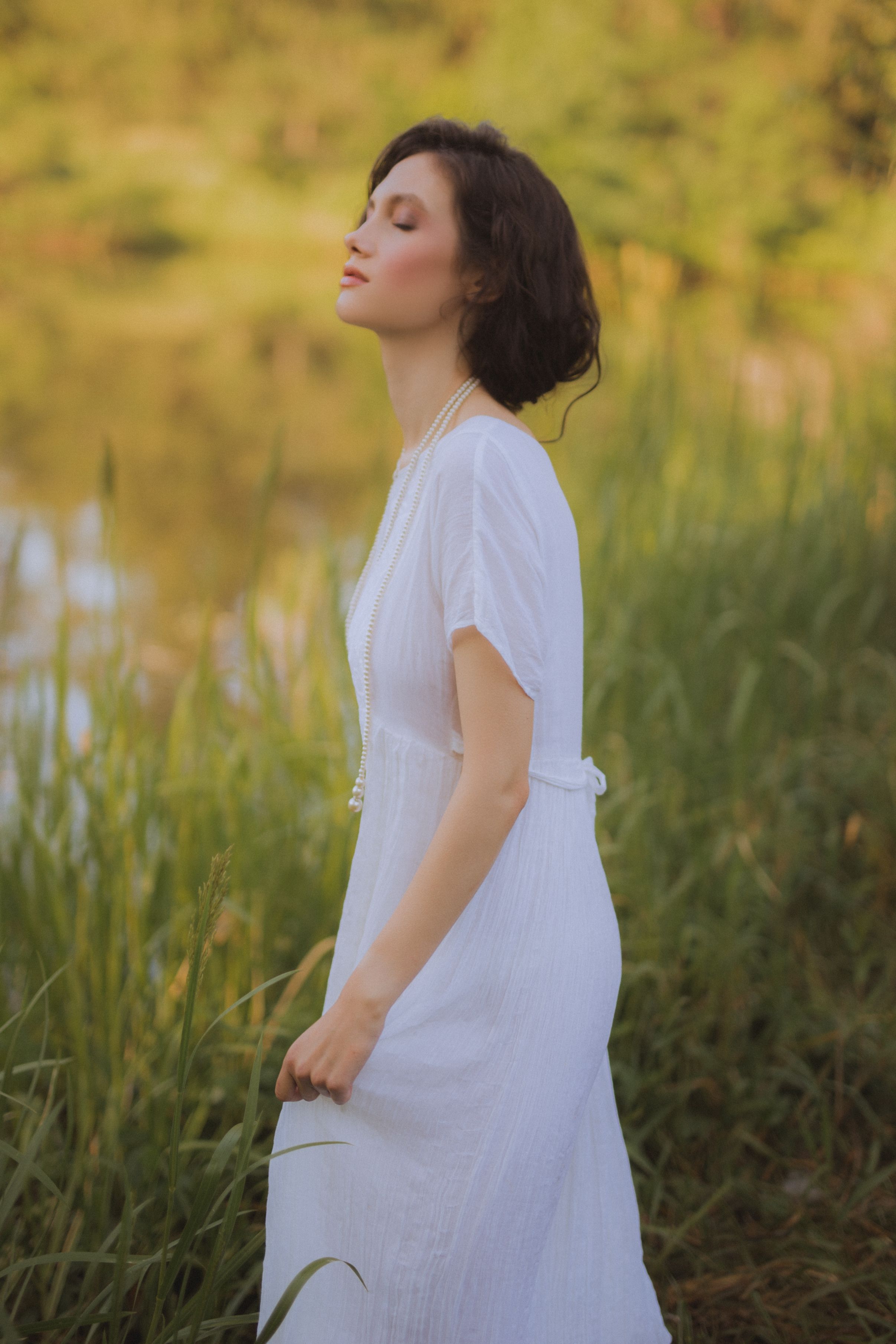 Woman in White Dress Standing on Green Grass Field · Free Stock Photo