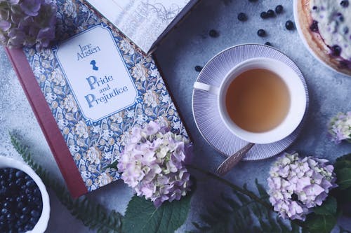 Free Cup of Tea near a Book Stock Photo