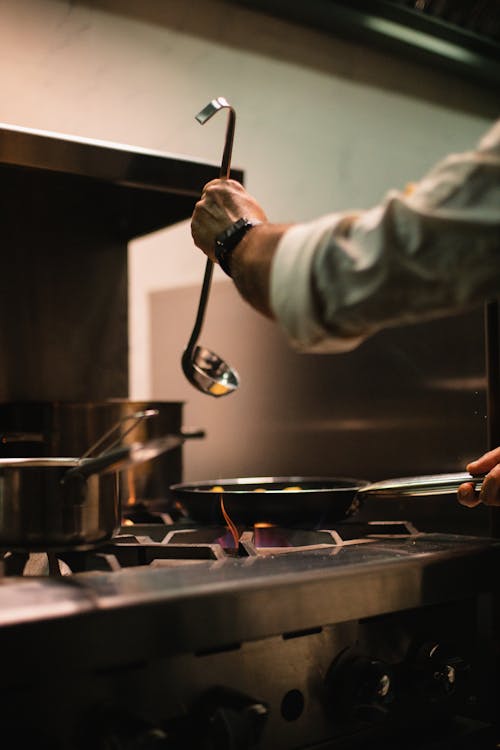 
A Person Cooking on a Stove