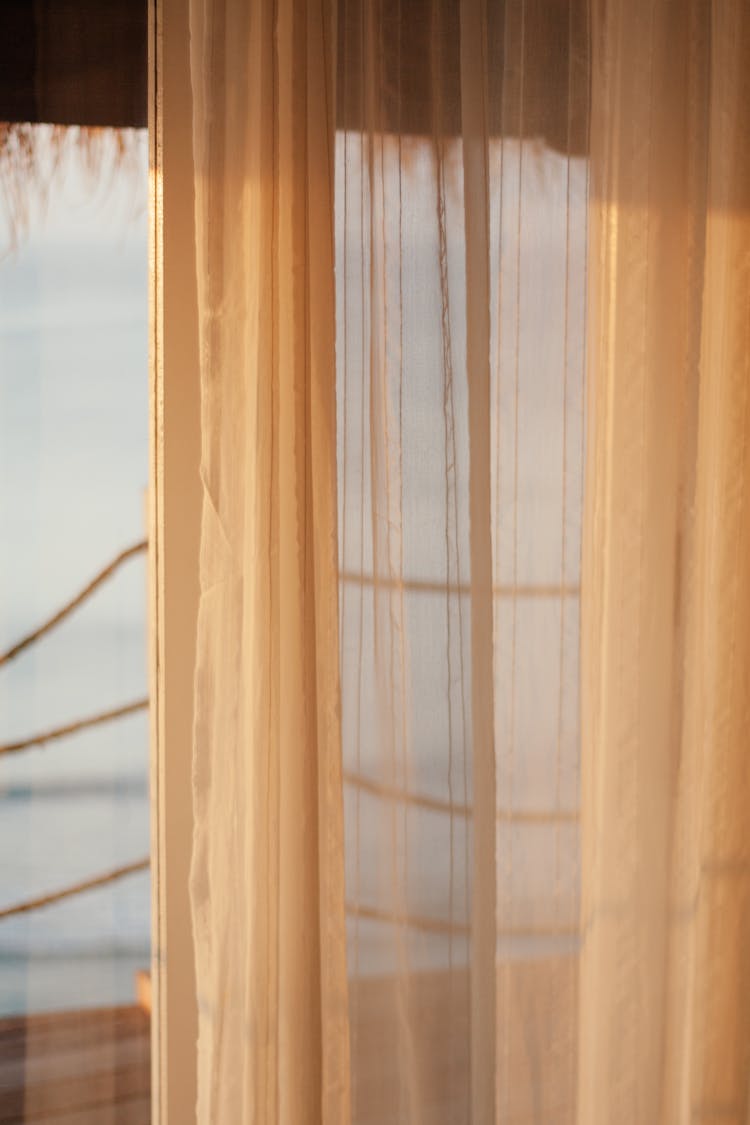 White See Through Curtain In The Window