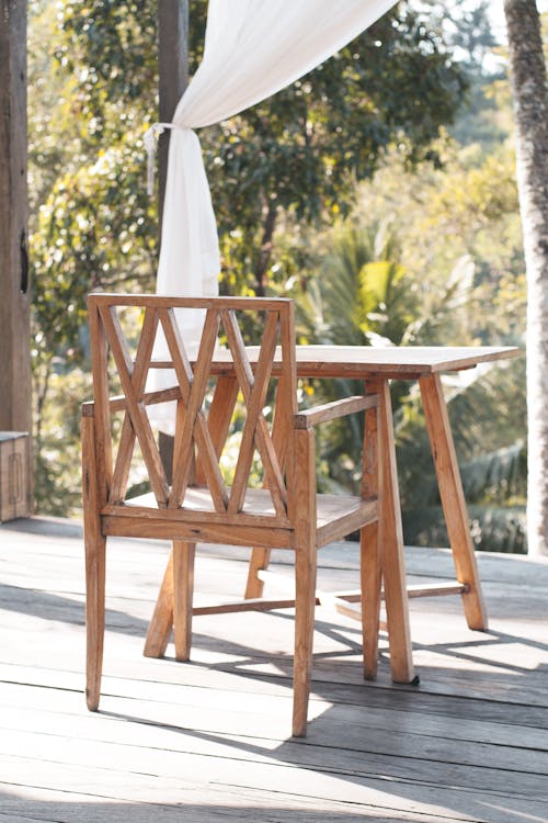 Brown Wooden Chair on Gray Concrete Floor