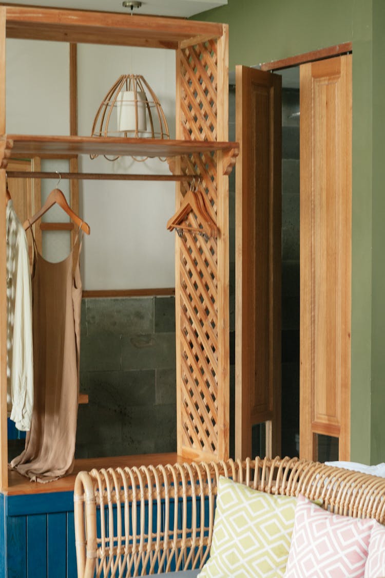 Hanging Dresses On A Wooden Cabinet 