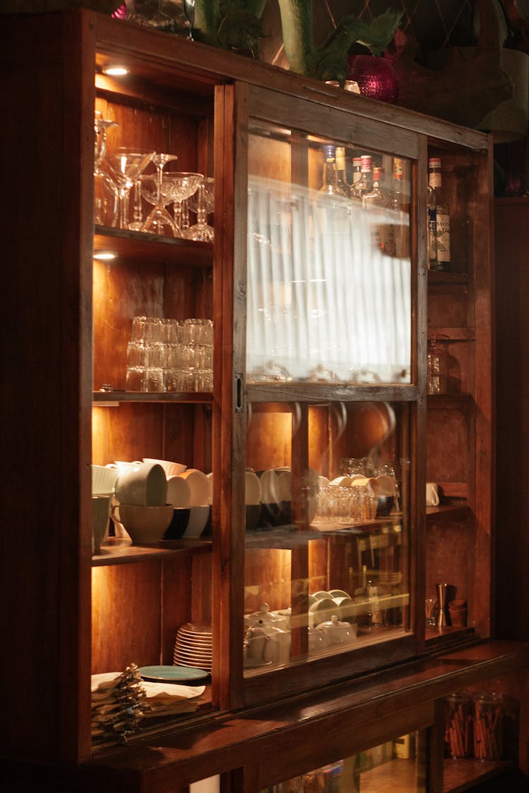 China Set And Glassware Displayed In Glass Cabinet