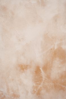 Close-up of a beige and light brown textured surface perfect for background or design use.
