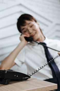 Woman Talking on a Telephone
