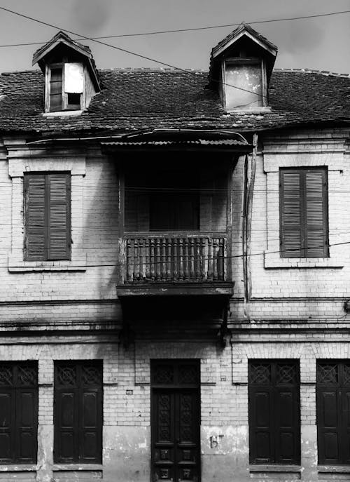 Grayscale Photo of an Abandoned House