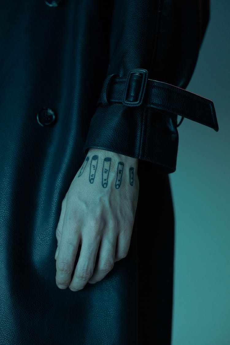 Close-up Of A Person With Hand Tattoo