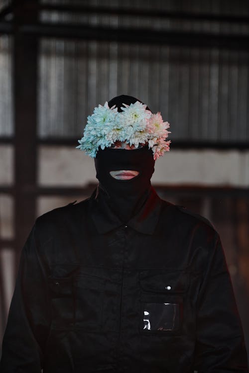 Free A Man Wearing Balaclava and White Flower Headband Stock Photo