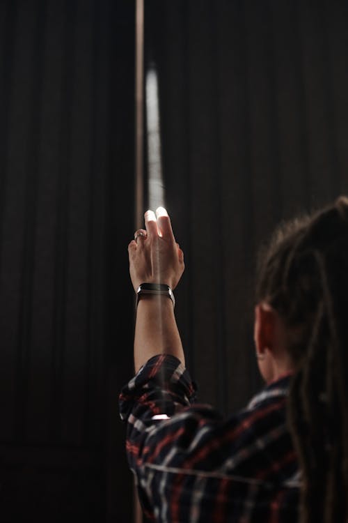 A Person Reaching for Light