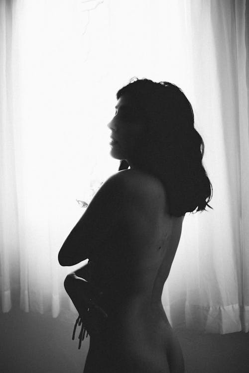 Black and White Photo of a Naked Woman
