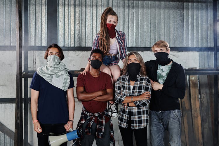 A Group Of People With Face Masks