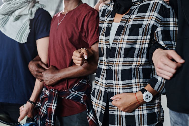 Group Of People Linking Arms 