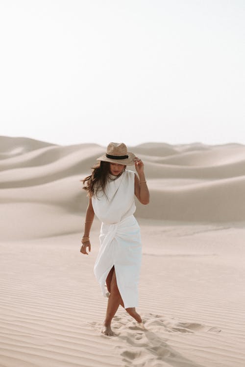 Free A Woman in a White Dress at a Desert  Stock Photo