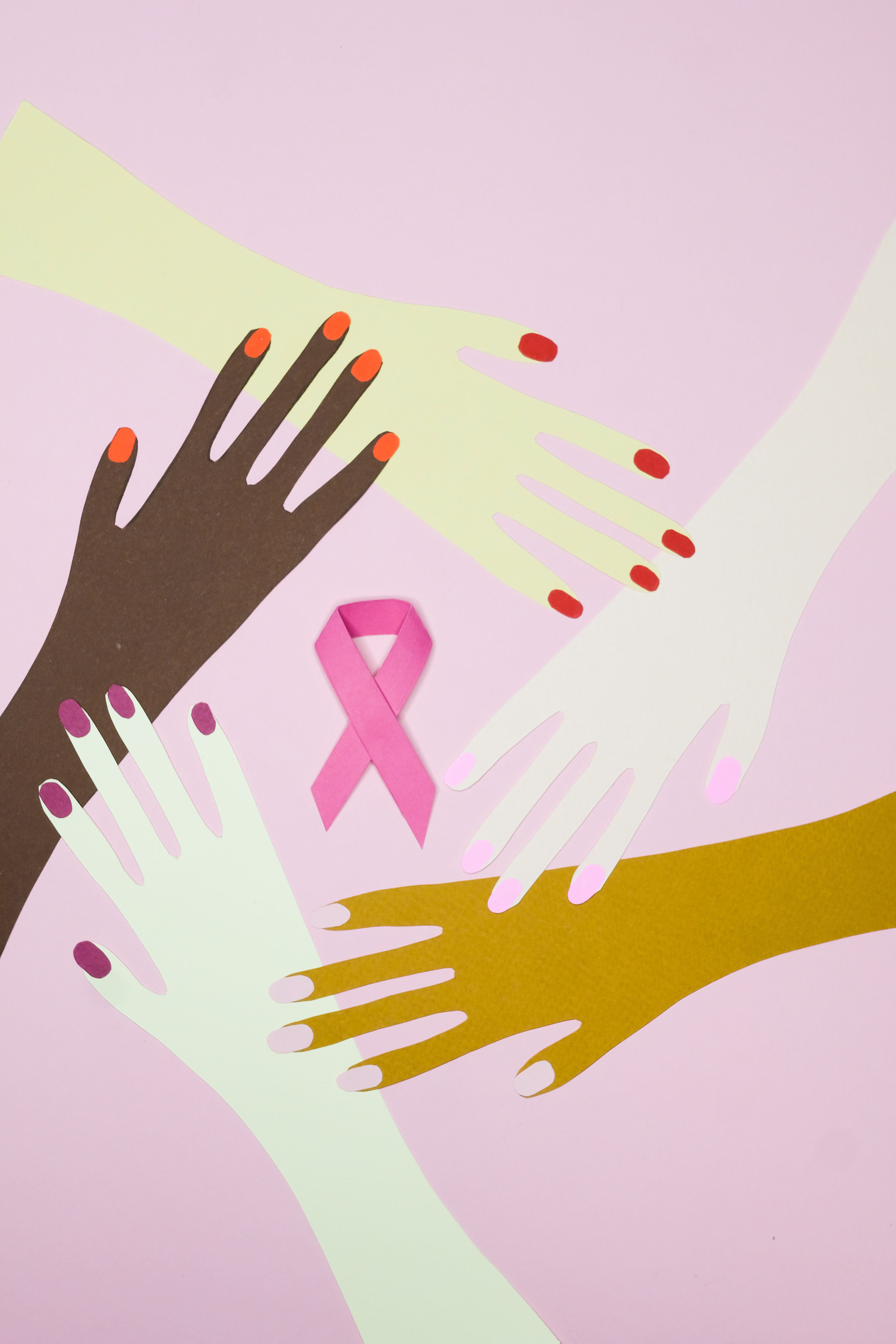 Paper Cutouts of Hands on a Pink Background · Free Stock Photo