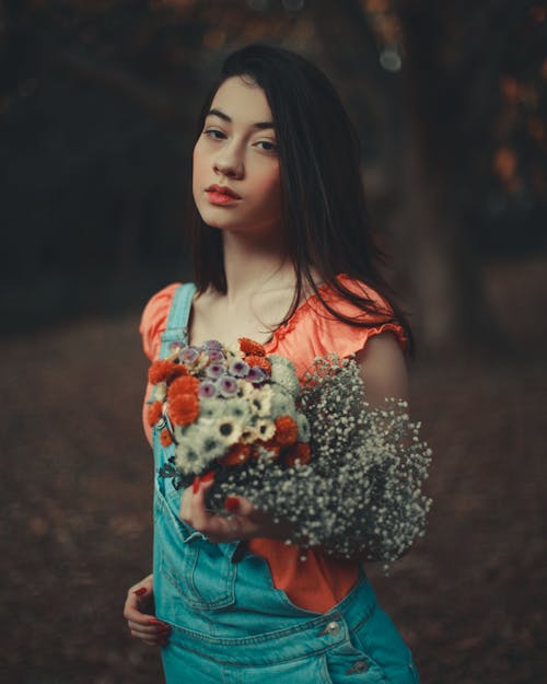 Beautiful Woman Holding Flowers