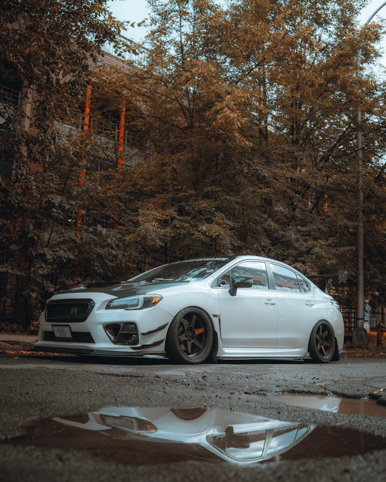 White Subaru Car Parked On Street Side