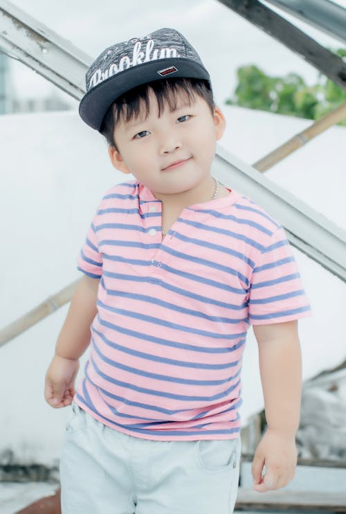 Kid Wearing a Black Cap