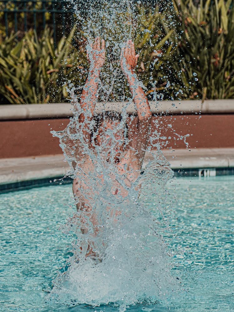 Photo Of A Boy Splashing Water