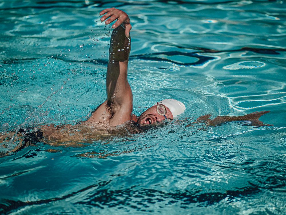 Free Swimmer Training in the Pool Stock Photo