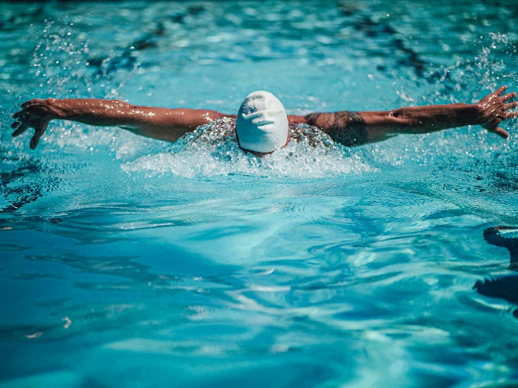 A Swimmer Doing The Butterfly Stroke