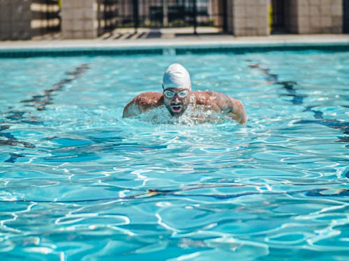 Free Man Swimming on a Pool Stock Photo