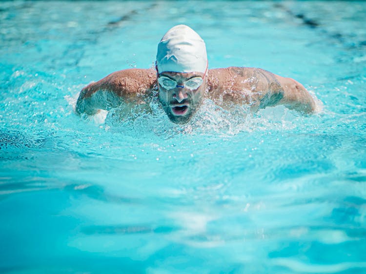 Man Wearing Goggles Swimming Fast